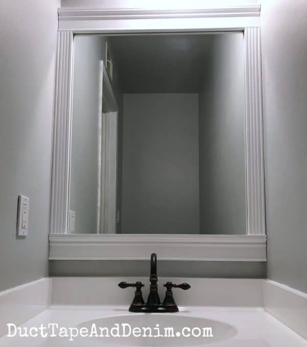 an easy way to frame a bathroom mirror