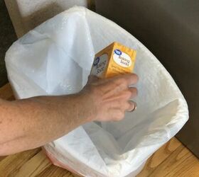 She pours baking soda into the trash for this clever household hack