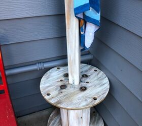 repurposed wooden spool to towel and table rack, This area holds personal items or cold drinks
