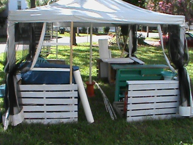 portable shelter tent up cycled with pallets and fencing