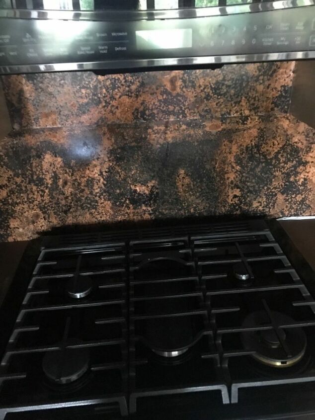q we have installed a mottled copper backsplash behind our stove