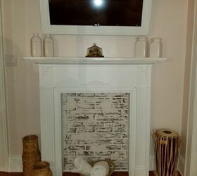 hanging bed faux brick guest room remodel, TV frame fireplace surround w faux brick