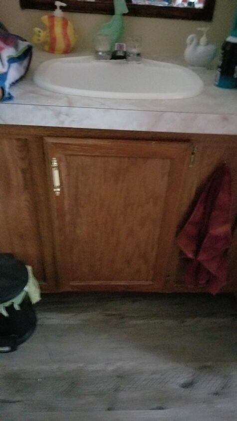q how do i open up a small undersink bathroom cabinet