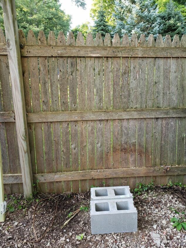 how to easily make a v shaped diy cinder block firewood rack, Placing the cinder blocks