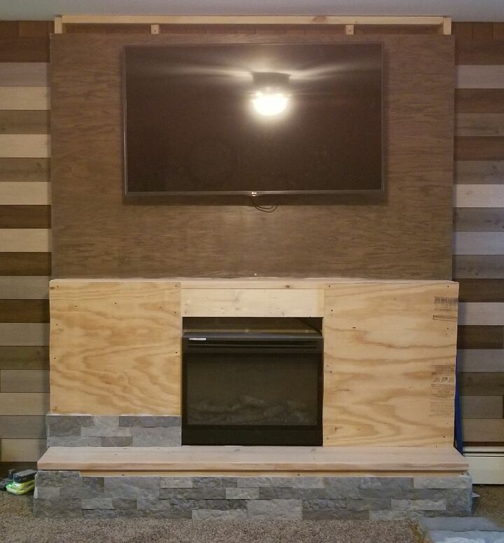 how to build a faux fireplace, Plywood added for support of the stone