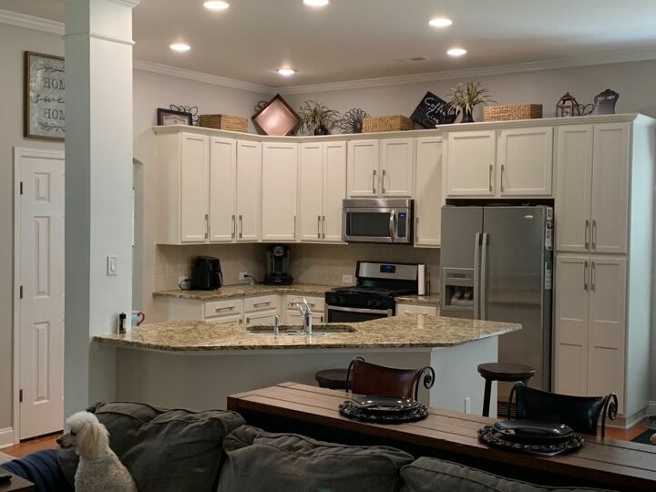 q should i restain or paint my cabinets