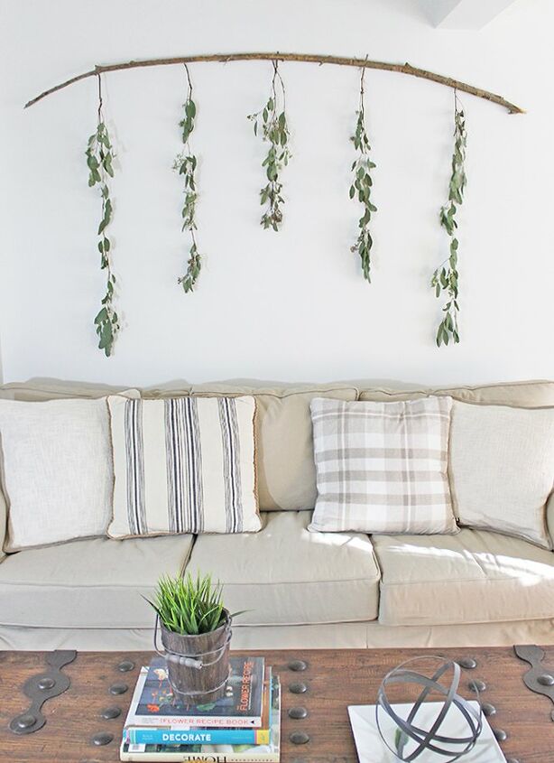 s 15 ways unexpected items are making these walls really stand out, A branch with hanging eucalyptus