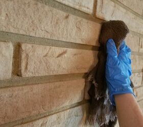 update your fireplace with whitewash, Clean the brick before starting