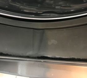 how do i clean the black mold on the rubber of my washing machine