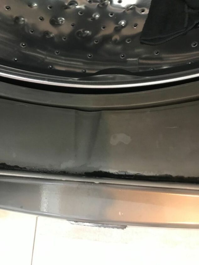 how do i clean the black mold on the rubber of my washing machine