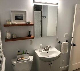 floating shelves between bathroom mirrors