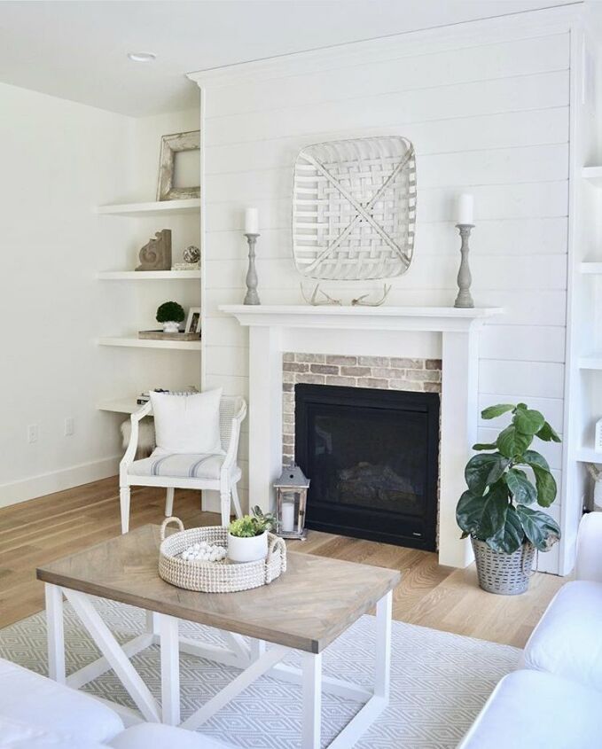 21 of our favorite feature accent gallery walls you can try today, This shiplap fireplace wall is just gorgeous