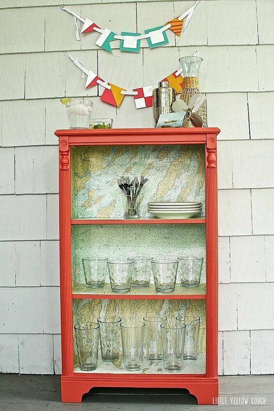 s 15 creative ways to use maps for stunning home decor, A bookcase turned wet bar with a map backing