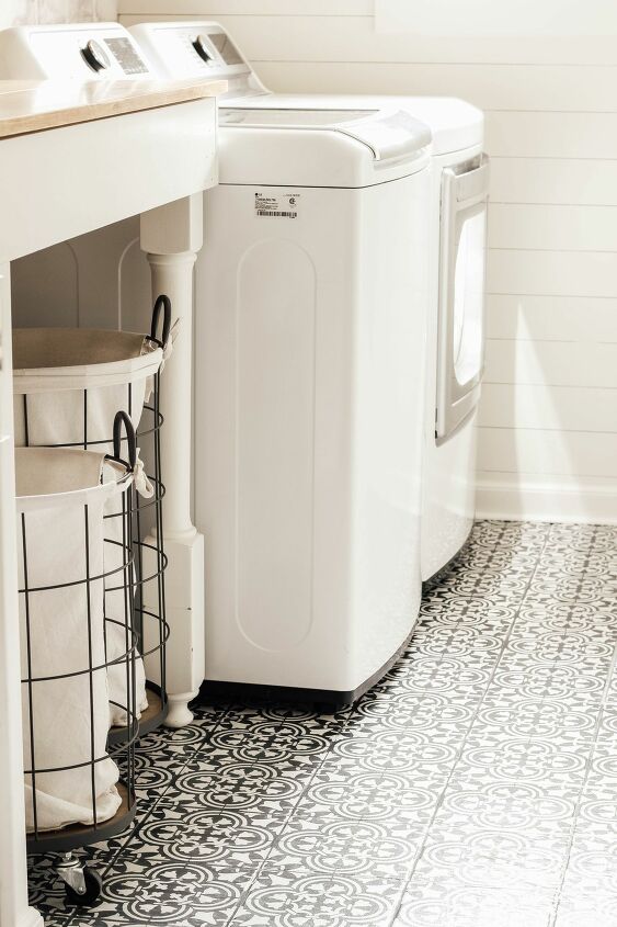 s 7 laundry room makeovers that ll make you want to do your laundry here, AFTER Gorgeous with stenciled floors