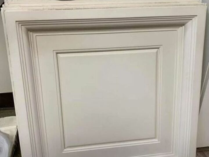 q ceiling tiles on a wall