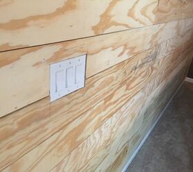 how to make a 50 shiplap plywood accent wall for your bedroom, Cut hole in the shiplap for a light switch
