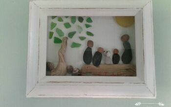 Familia de guijarros en un marco de caja de sombra