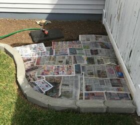 replaced some lawn with a rock garden, Newpaper to help prevent weed growth