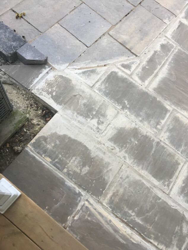 how can i fix this mess of grout left on our walkway stones