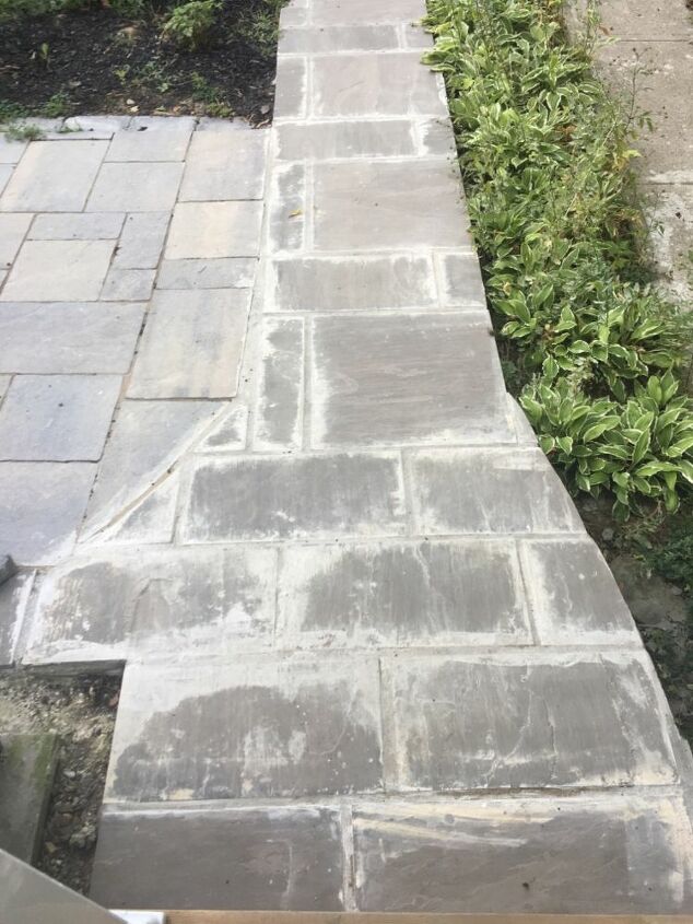 how can i fix this mess of grout left on our walkway stones