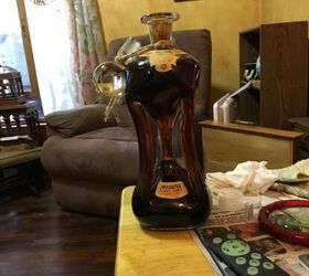 How can I seal the label on a very old wine bottle to preserve it