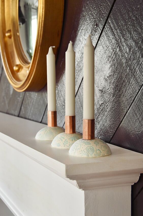 s 14 ways to make you home a cozy oasis, Add even more ambiance with these stamped clay candle holders