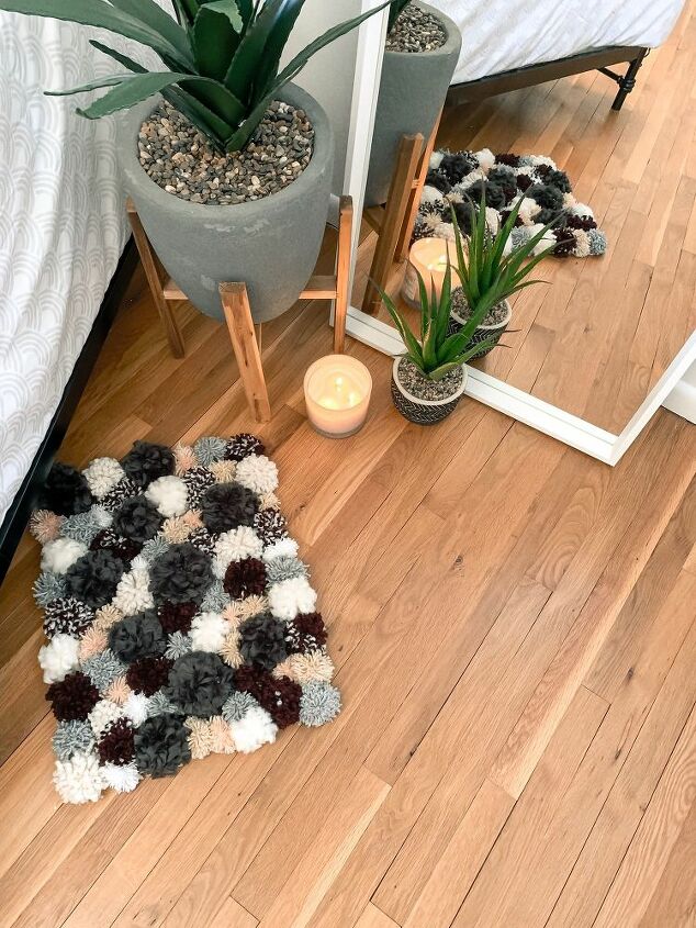 diy a cozy rug using pom poms
