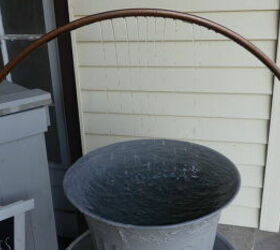 an old hula hoop a thrift store water pump and trashed planters