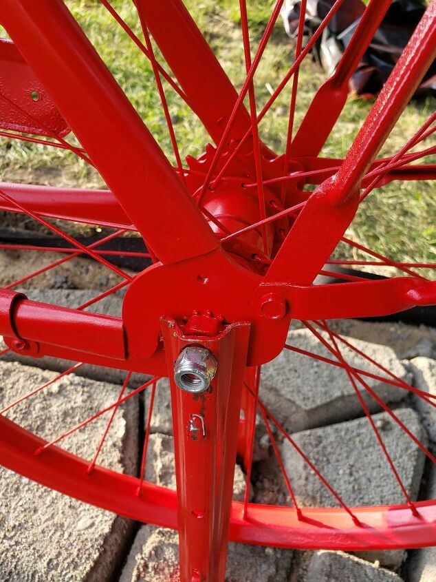 how we made a simple diy walkway for our cute bicycle mailbox, Bolting the bike in place