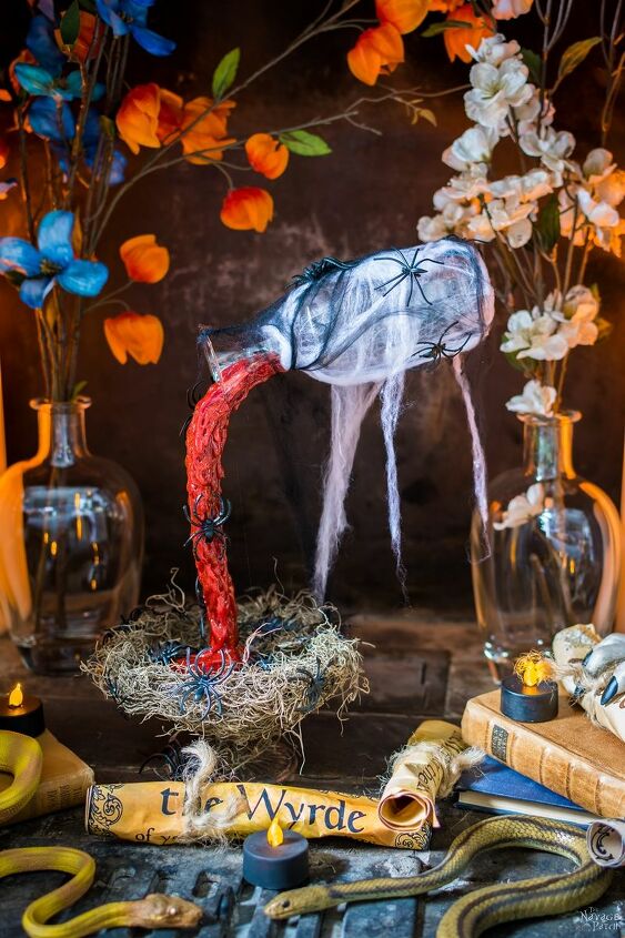 s 17 spooky halloween decor ideas that will scare your guests, Dollar store Halloween mummy decor