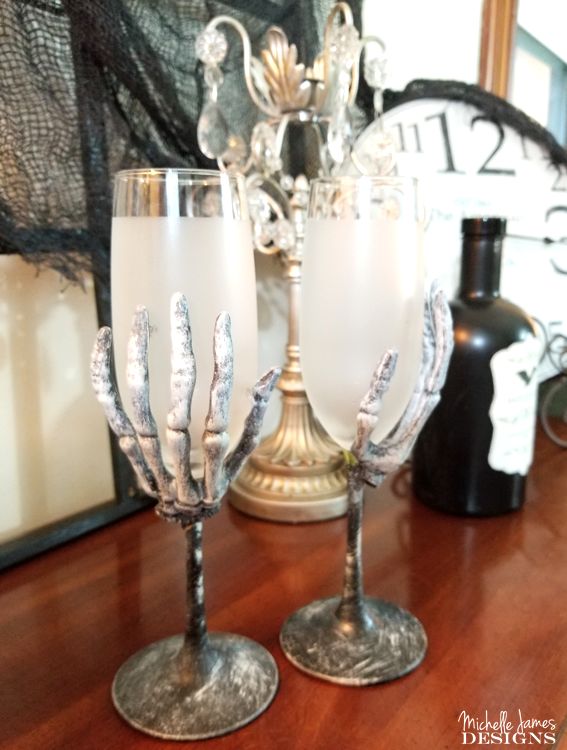 s 17 spooky halloween decor ideas that will scare your guests, Creepy skeleton wine glasses