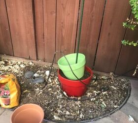 q what is the best way to stack flower pots using a tall stick or rod