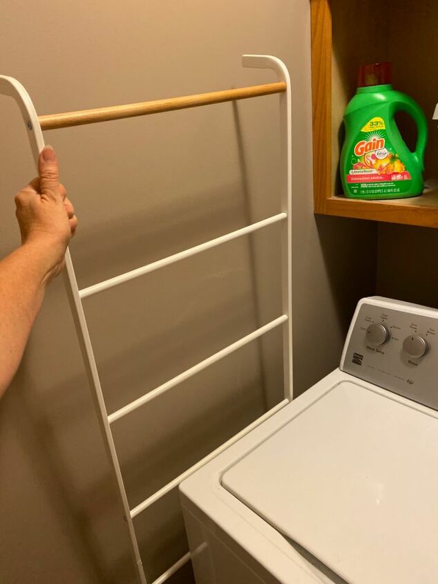 how i use a leaning towel rack and s hooks to sort laundry