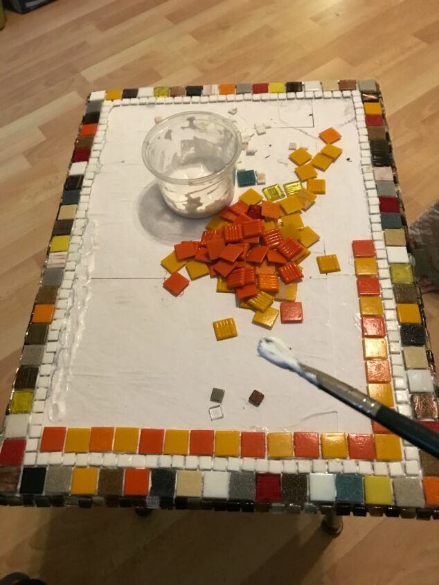 how to transform an old coffee table with mosaic, Building the design with small and large glas