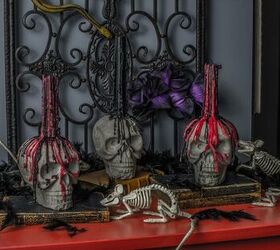 16 spooky halloween decor ideas that will scare your guests, Faux concrete skull candle holders