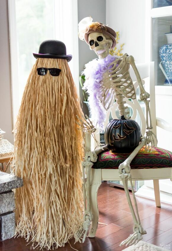 16 spooky halloween decor ideas that will scare your guests, Who invited Cousin Itt to the party