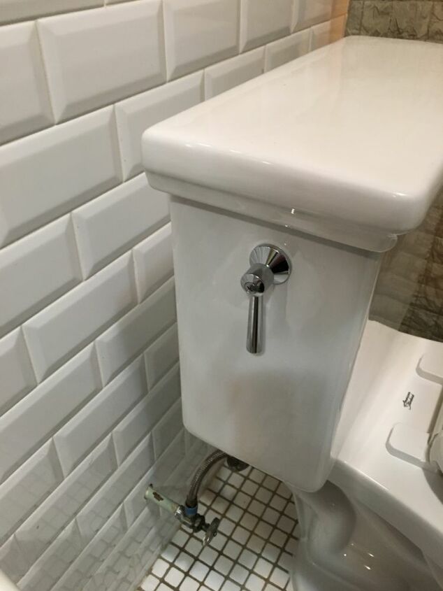 q three inch space between the wall and toilet tank