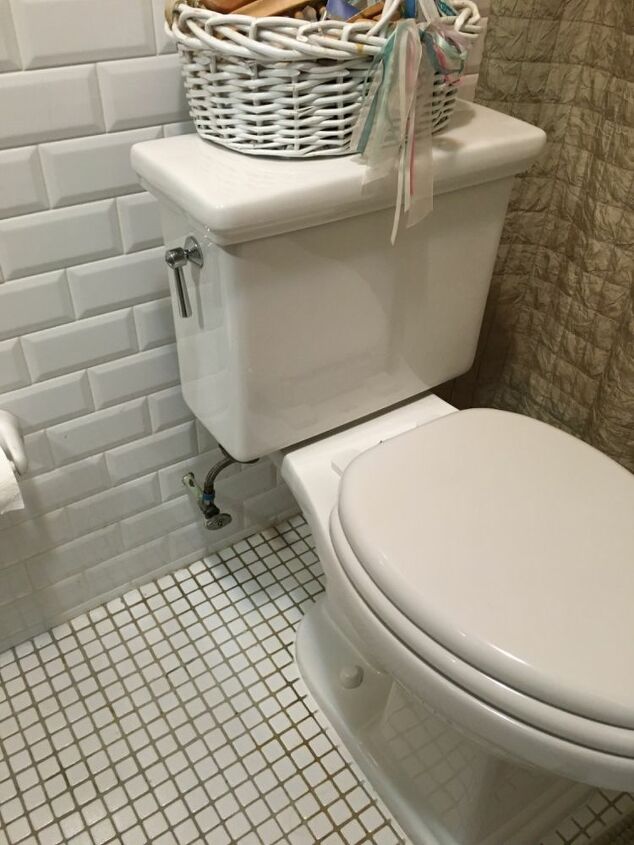 q three inch space between the wall and toilet tank