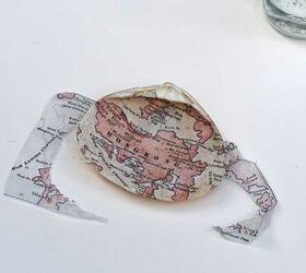 a coastal christmas gift with maps and shells