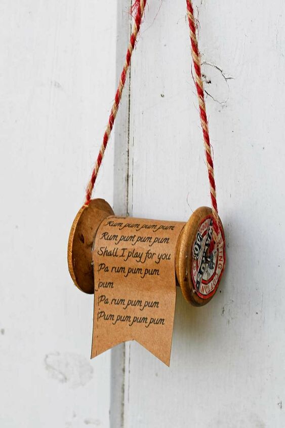 s 25 unconventional christmas ornament ideas for 2019, Wooden spool Christmas song ornament