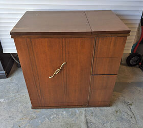 old sewing cabinet gets re purposed, Before