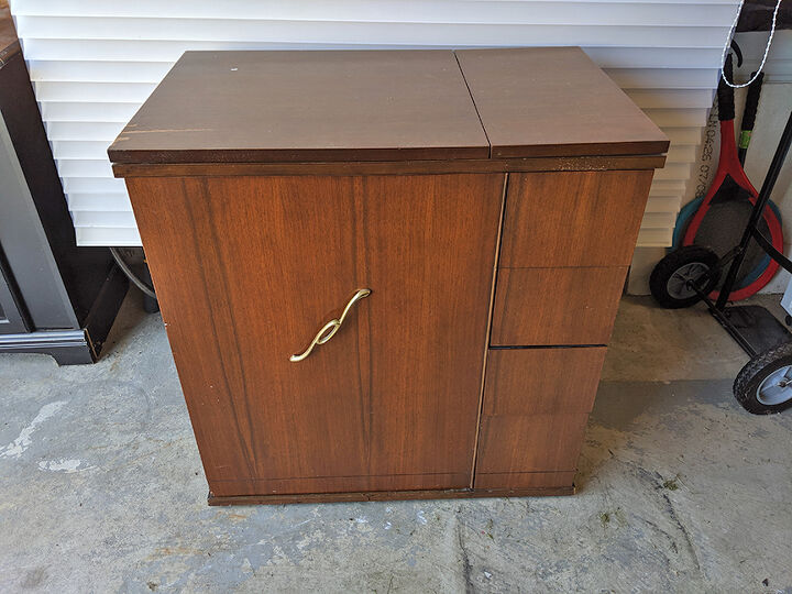 old sewing cabinet gets re purposed, Before