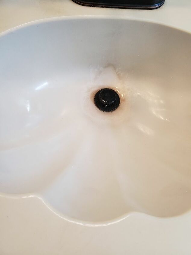 how can i thoroughly clean my laminate shell shaped bathroom sink