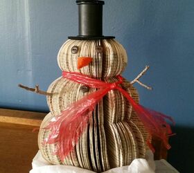 s 17 ways people are repurposing items to make christmas decor, Upcycled Book Snowman Christmas Decoration