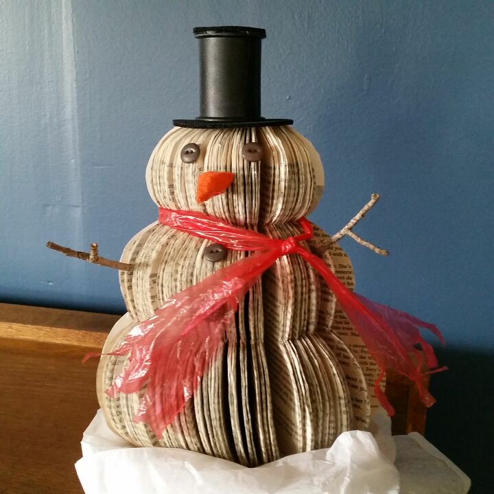 s 17 ways people are repurposing items to make christmas decor, Upcycled Book Snowman Christmas Decoration