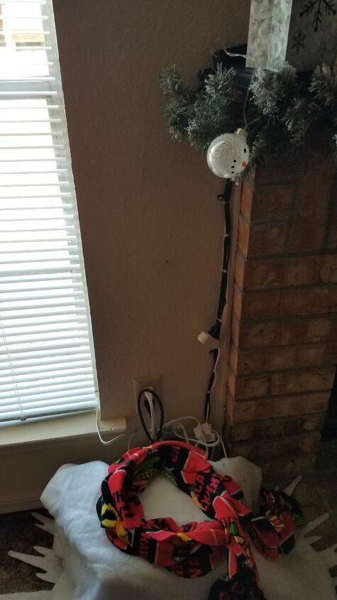 how can i hide cords that run down the wall near the mantle