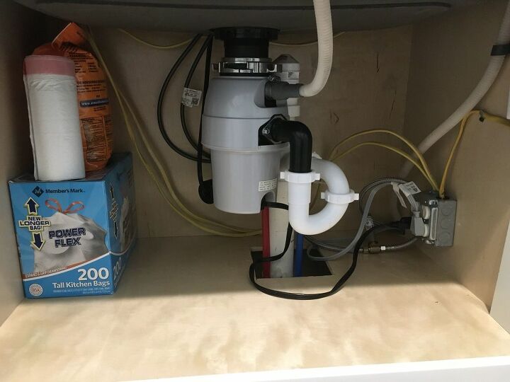 what could be causing a smell coming from under the kitchen sink