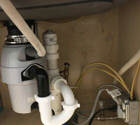 What could be causing a smell coming from under the kitchen sink