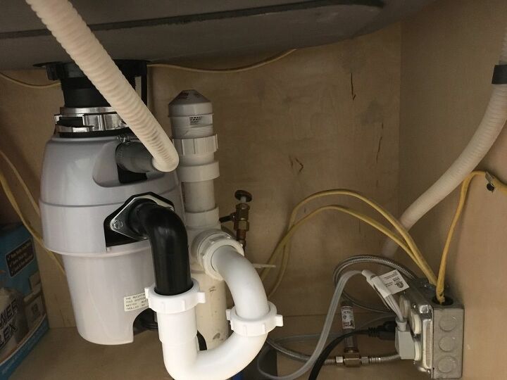 what could be causing a smell coming from under the kitchen sink