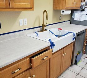 She tapes off her countertops for a gorgeous $125 update